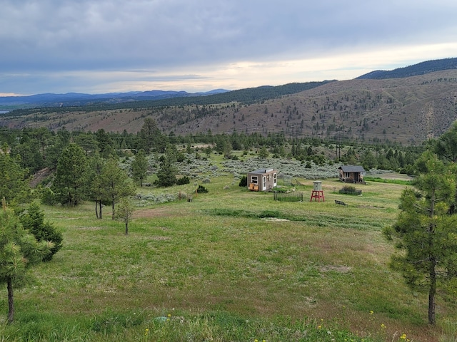 property view of mountains featuring a rural view
