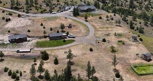 bird's eye view with a desert view and a rural view