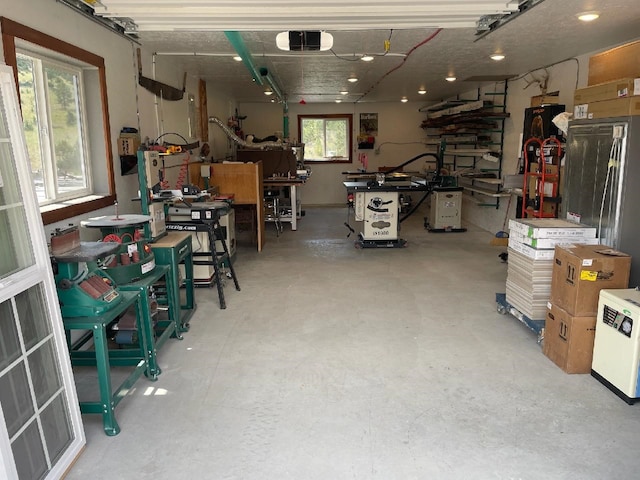 garage featuring a workshop area and a garage door opener