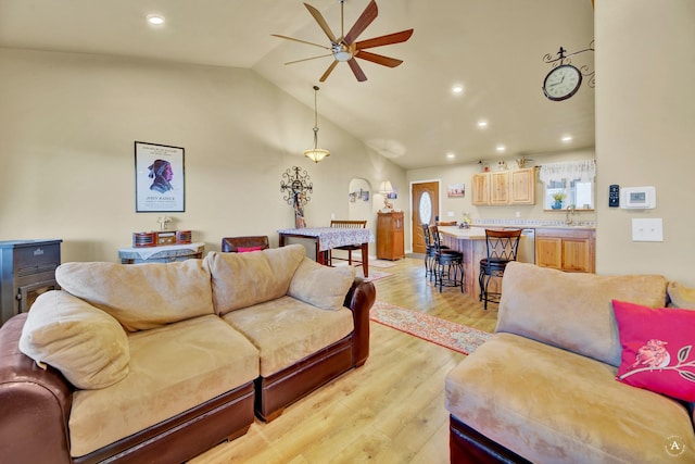 living area with a ceiling fan, recessed lighting, light wood-style flooring, and lofted ceiling
