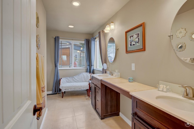 bathroom featuring tile patterned flooring, recessed lighting, baseboards, and vanity