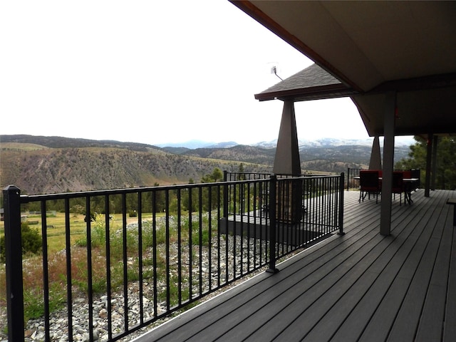wooden terrace featuring a mountain view