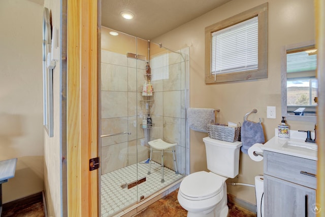 full bathroom featuring vanity, toilet, recessed lighting, baseboards, and a stall shower