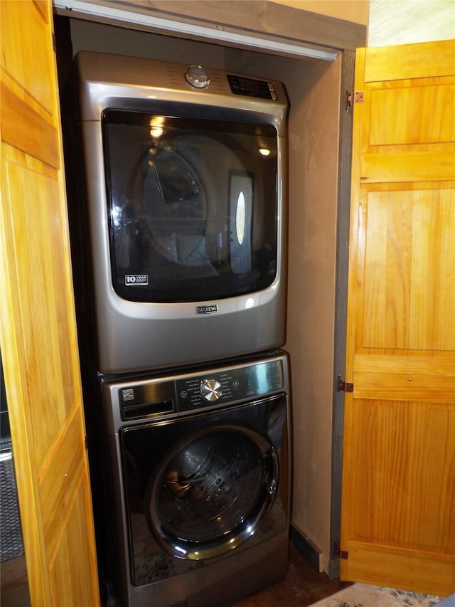 laundry room featuring laundry area and stacked washing maching and dryer