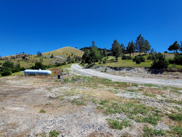 mountain view featuring a rural view