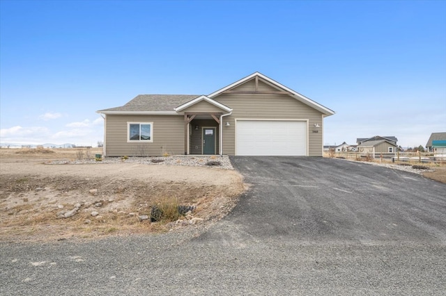 ranch-style house featuring a garage