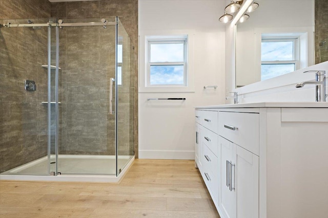 5468 Fireweed Loop, Helena, MT 59602 - full bath featuring double vanity, wood finished floors, and a stall shower