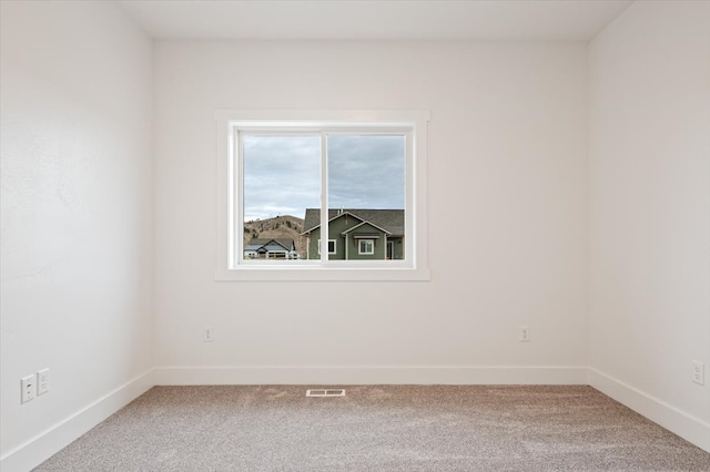 unfurnished room featuring carpet floors