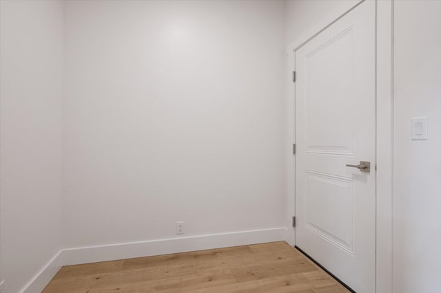 unfurnished room with light wood-type flooring