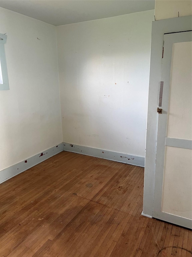 empty room with wood-type flooring