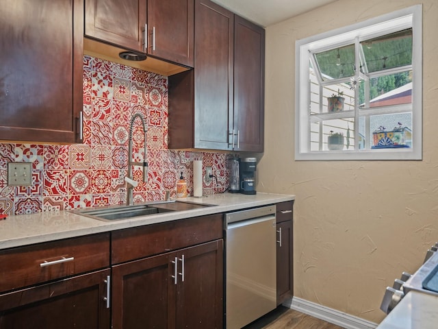 1915 E Broadway St, Missoula, MT 59802 - kitchen featuring stainless steel dishwasher, a sink, and light countertops