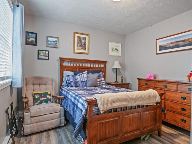 1915 E Broadway St, Missoula, MT 59802 - bedroom featuring a textured ceiling and wood finished floors