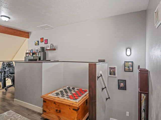 1915 E Broadway St, Missoula, MT 59802 - hallway with attic access, a textured ceiling, wood finished floors, baseboards, and an upstairs landing