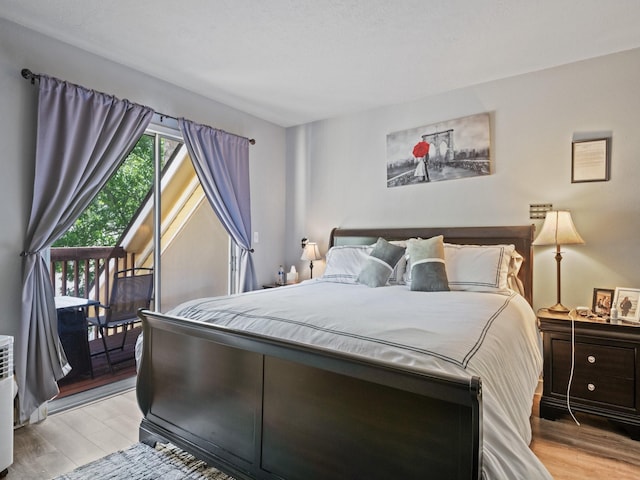 1915 E Broadway St, Missoula, MT 59802 - bedroom featuring light wood finished floors and access to exterior