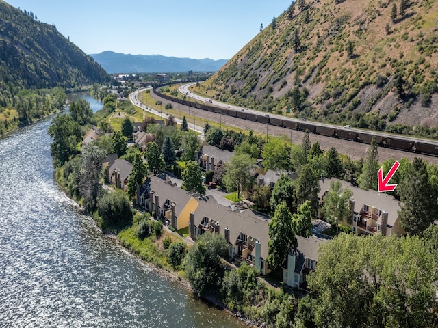 birds eye view of property featuring a water and mountain view