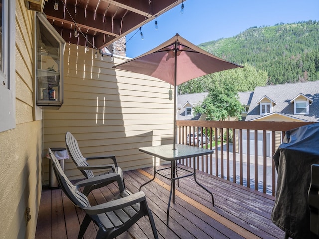 1915 E Broadway St, Missoula, MT 59802 - wooden terrace featuring a mountain view and a wooded view