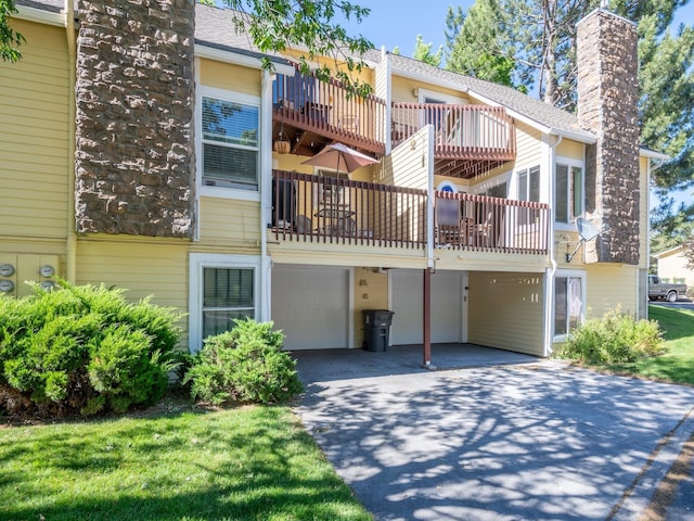 1915 E Broadway St, Missoula, MT 59802 - view of property with an attached garage and driveway