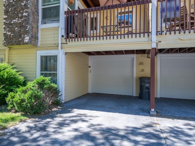 1915 E Broadway St, Missoula, MT 59802 - exterior space featuring an attached garage, driveway, and a balcony