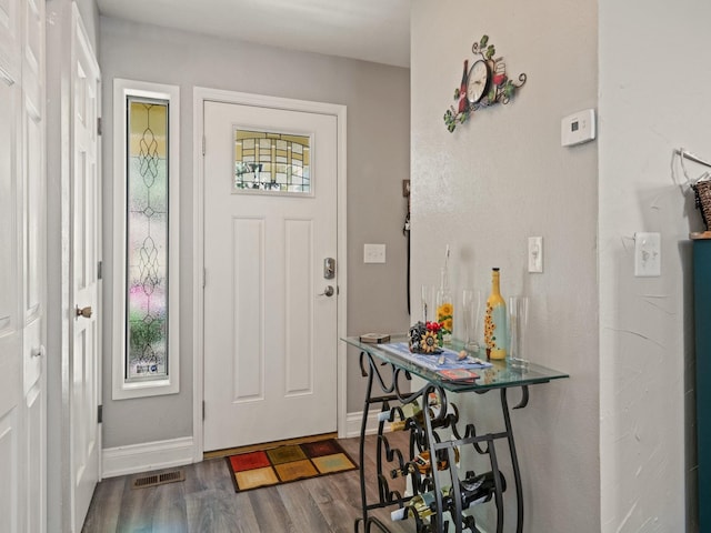 1915 E Broadway St, Missoula, MT 59802 - foyer featuring baseboards, visible vents, and dark wood-style floors
