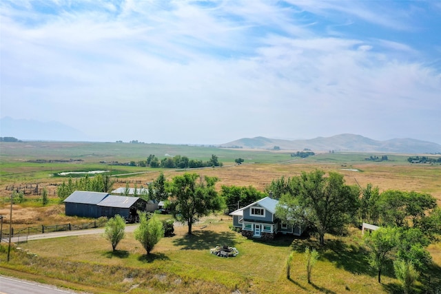 birds eye view of property featuring a mountain view and a rural view