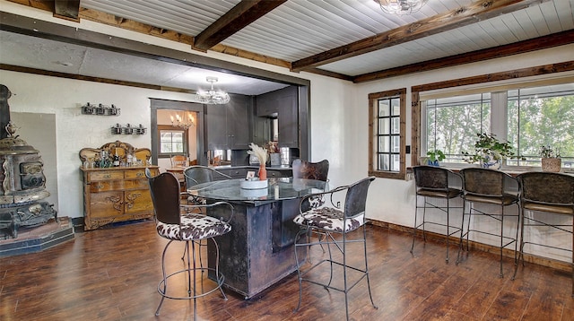 dining room featuring beamed ceiling, a wealth of natural light, a notable chandelier, and dark hardwood / wood-style flooring