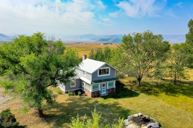 drone / aerial view with a rural view and a mountain view