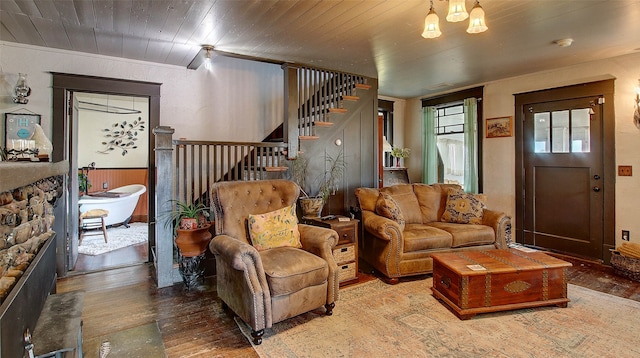 living room with a chandelier, hardwood / wood-style floors, and wood ceiling