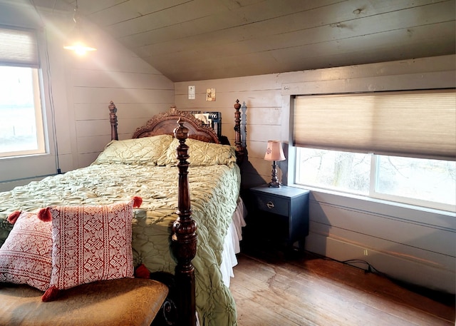 bedroom featuring lofted ceiling, wood ceiling, and wood-type flooring