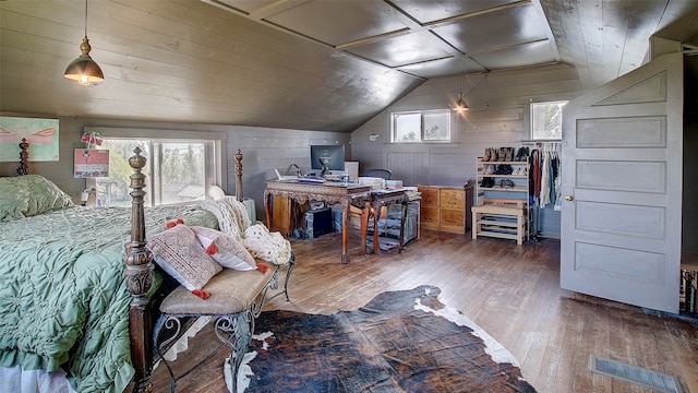 bedroom featuring hardwood / wood-style flooring, lofted ceiling, wood ceiling, and wooden walls