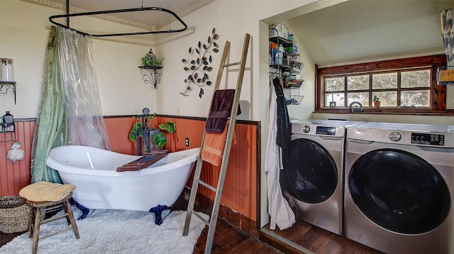 clothes washing area with hardwood / wood-style flooring and separate washer and dryer