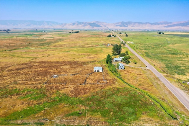 birds eye view of property featuring a rural view and a mountain view