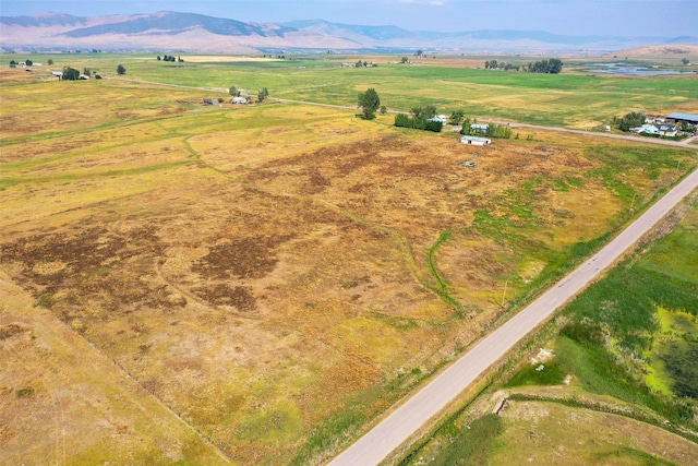 birds eye view of property featuring a rural view and a mountain view