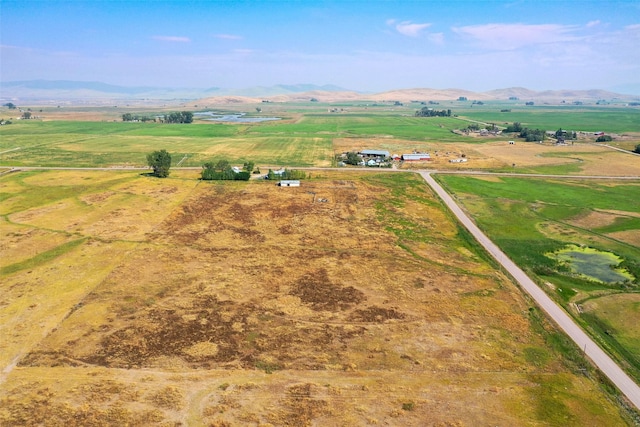 aerial view featuring a rural view and a mountain view