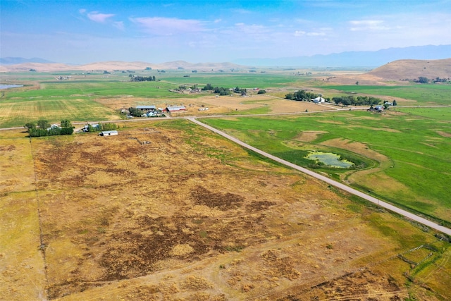 aerial view featuring a mountain view and a rural view