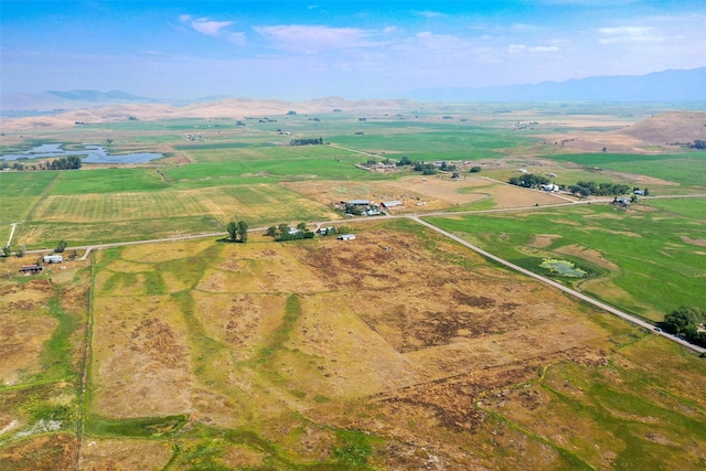 drone / aerial view with a mountain view and a rural view