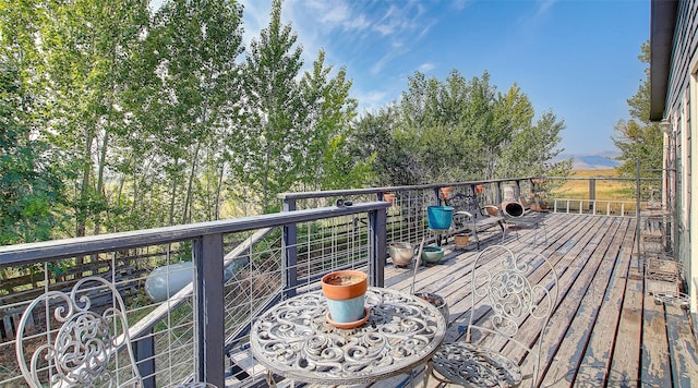 wooden deck featuring a mountain view