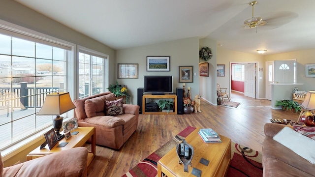 33953 Fox Rd, Polson, MT 59860 - living area featuring plenty of natural light, wood finished floors, vaulted ceiling, and ceiling fan