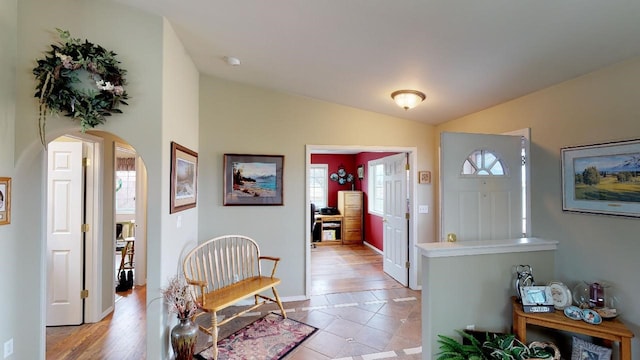 33953 Fox Rd, Polson, MT 59860 - entrance foyer featuring vaulted ceiling, arched walkways, and healthy amount of natural light