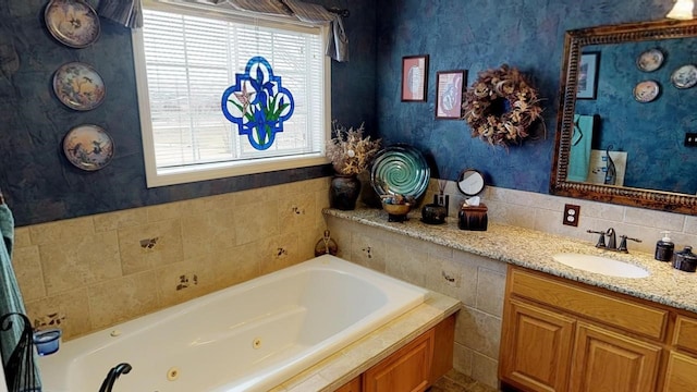 33953 Fox Rd, Polson, MT 59860 - bathroom with healthy amount of natural light, a jetted tub, vanity, and wallpapered walls