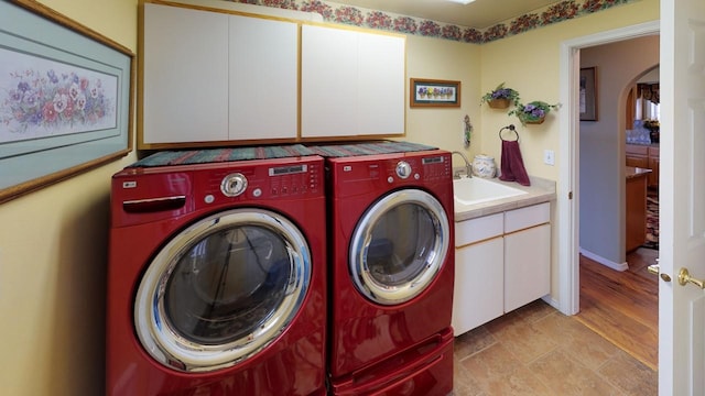 33953 Fox Rd, Polson, MT 59860 - washroom featuring cabinet space, independent washer and dryer, and arched walkways