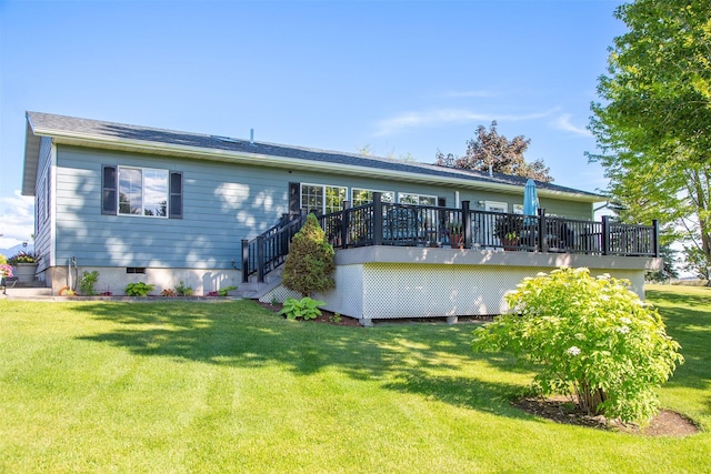 33953 Fox Rd, Polson, MT 59860 - back of house featuring a deck and a lawn
