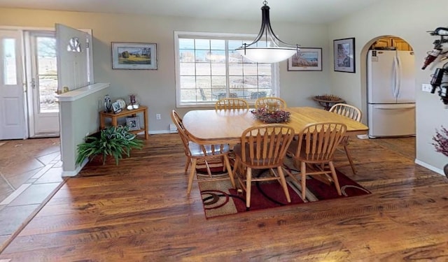 33953 Fox Rd, Polson, MT 59860 - dining area featuring wood finished floors and arched walkways
