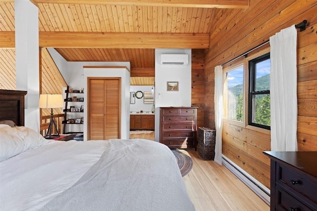 bedroom with beamed ceiling, baseboard heating, a wall unit AC, and wooden walls