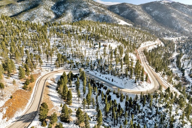 snowy aerial view featuring a mountain view