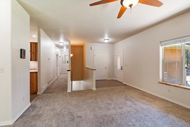 carpeted empty room with ceiling fan