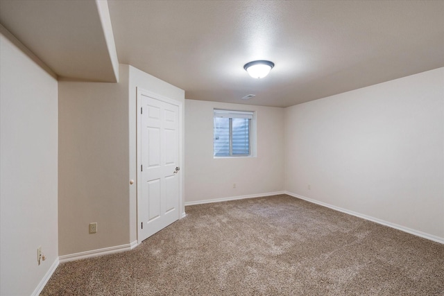 basement featuring carpet flooring