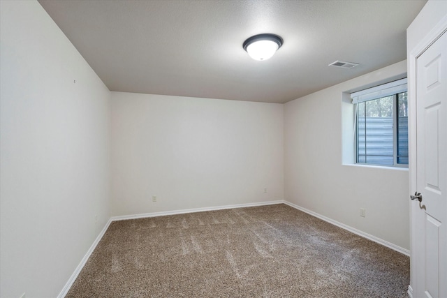 unfurnished room with carpet flooring