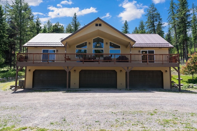 view of front facade featuring a garage and a deck