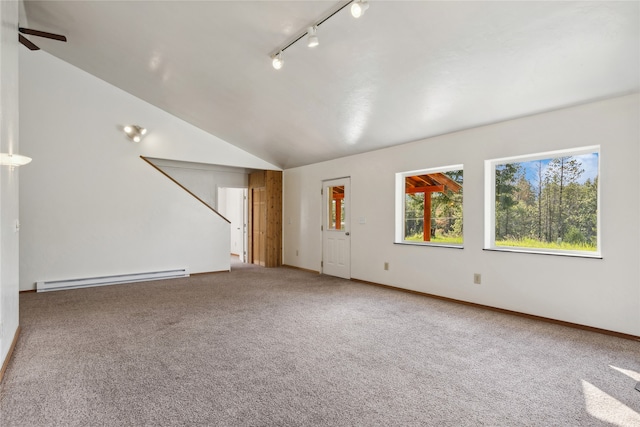 unfurnished room with rail lighting, ceiling fan, carpet flooring, a baseboard heating unit, and vaulted ceiling