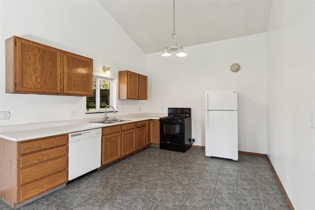 kitchen with white appliances, hanging light fixtures, sink, high vaulted ceiling, and a chandelier